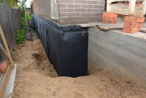 Happy homeowners after waterproofing job in Pineville